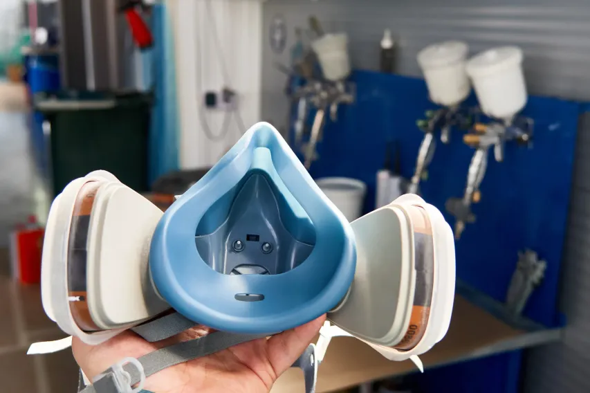Close-up of reusable respirator mask used for workplace protection against airborne hazards