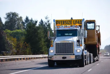 Commercial vehicle in transit underlining the role of MOU standards in Canada.