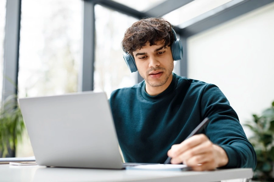 European man is virtual proctored while taking a course