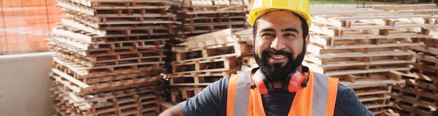 Happy Worker With Forklift Smiling