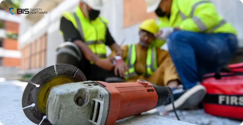 Injured construction worker receives first aid.
