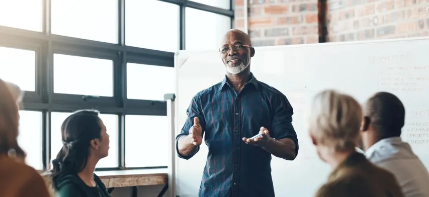 - BIS Safety Software Senior business man doing presentation, planning and talking in a meeting, seminar or training workshop in a boardroom. Manager sharing ideas and teaching training record management