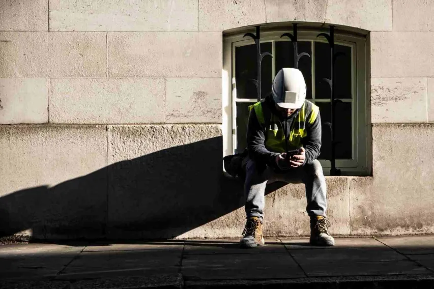 Team member at workplace woth mental health issues Employee takes a break due to mental health issues and contemplates his problems.